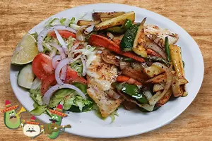 Chicken breast stuffed with cheese and ham served with grilled vegetables