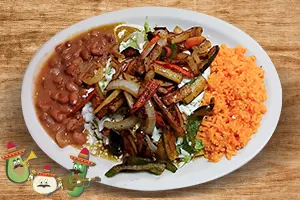 Veggie enchiladas topped with cheese and fresh vegetables