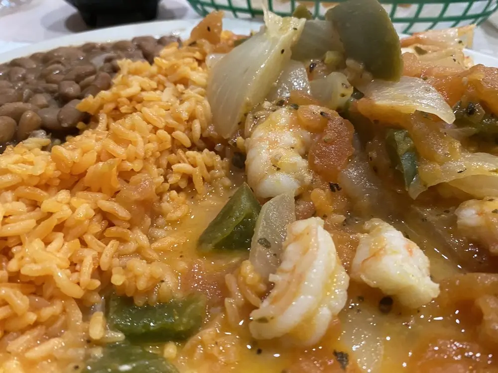 Shrimp platter served with rice, beans, and corn tortillas