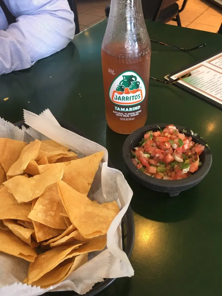 Classic nachos topped with melted Monterey Jack cheese, jalapeños, pico de gallo, and fresh cheese