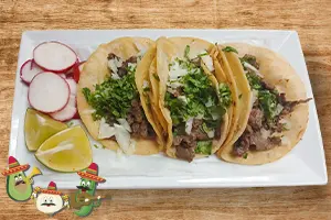 Carne asada tacos with grilled steak, onions, and cilantro